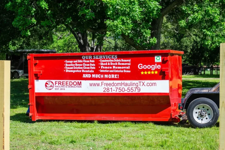 18 yard roll-off dumpster being dropped at a clients property for loading